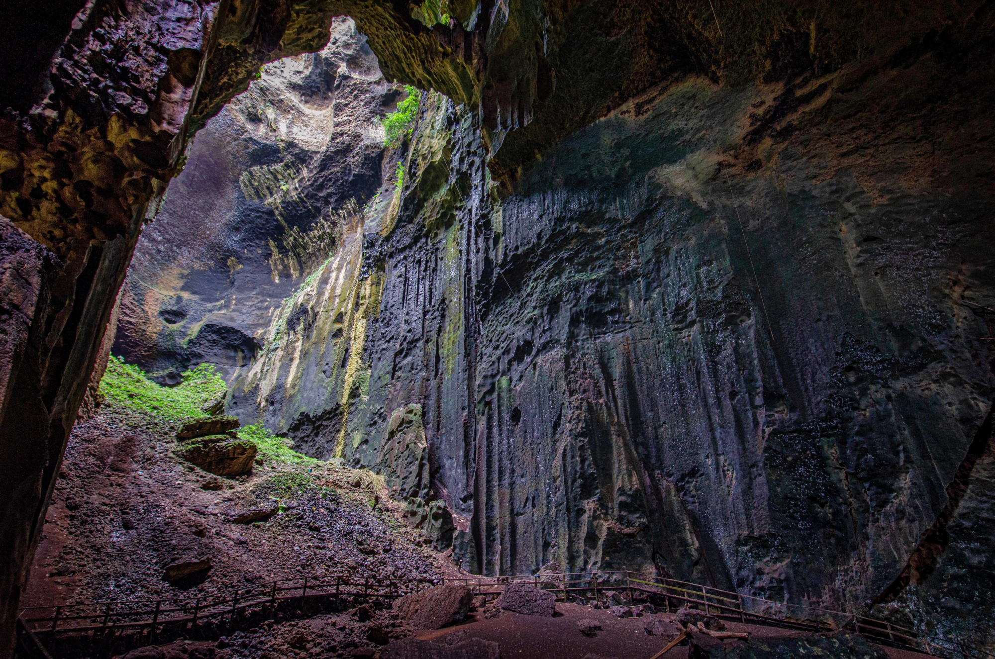 Interior of Gomantong's Simud Hitam cave chamber with skylight